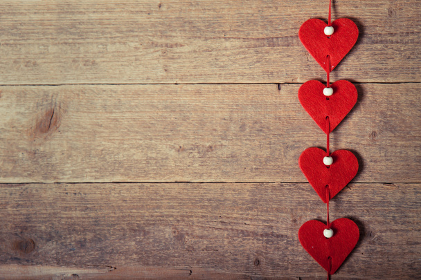 Hearts on the wood background - 写真・画像