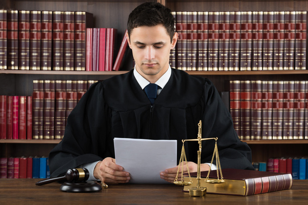 Judge Reading Documents At Desk - Photo, Image