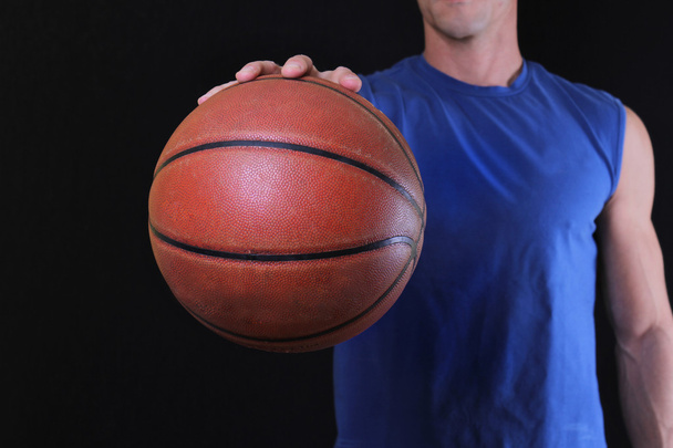 Close up of basketball player  man holding a basketball. Sport, active lifestyle concept - Fotoğraf, Görsel