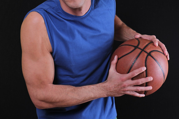 Man Basketball player prepare to shoot ball.  Close up of man holding a basketball. Sport, active lifestyle concept - Valokuva, kuva