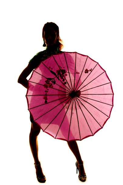 silhouette of beautiful woman with umbrella - Fotó, kép