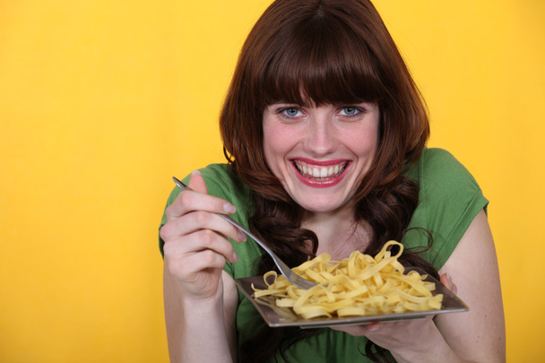 Woman eating tagliatelle - Fotó, kép