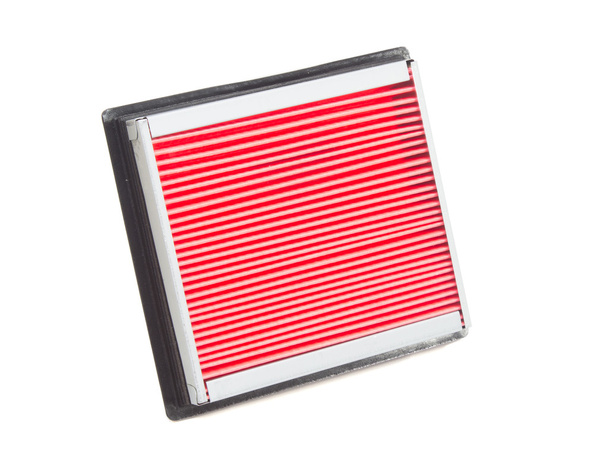 Platte motor luchtfilter in een plastic geval op een witte achtergrond - Foto, afbeelding