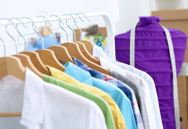 Clothes hang on a shelf in  designer clothes store - Zdjęcie, obraz