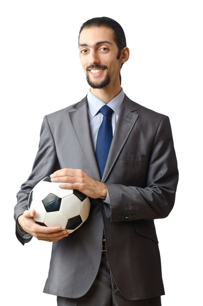 Businessman holding football on white - Фото, изображение