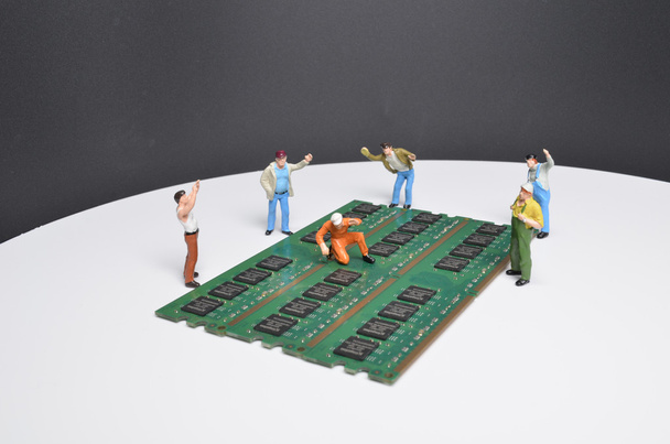 Miniature construction workers installing RAM memory  - Photo, Image