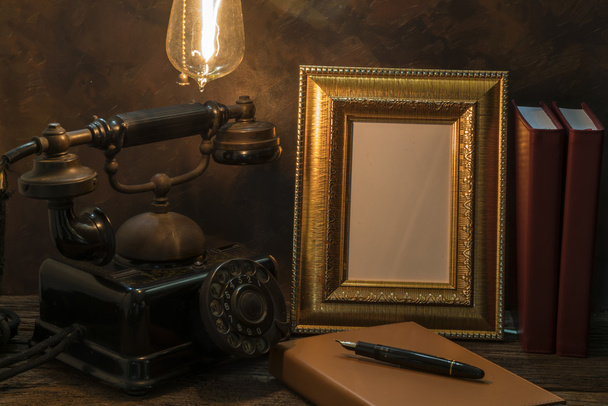Still life of vintage telephone with picture frame and diary on  - Fotoğraf, Görsel