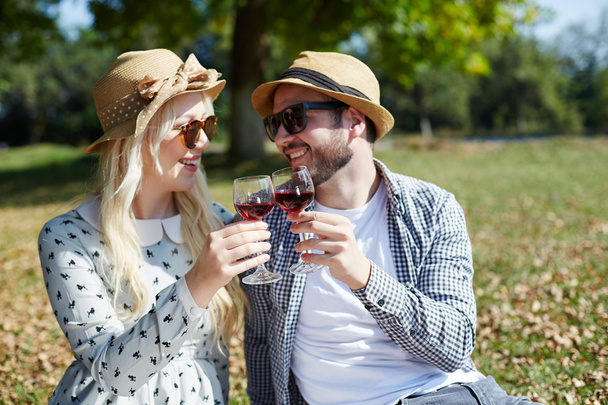 Romantic young couple having a great time, with glass of vine. p - Fotografie, Obrázek
