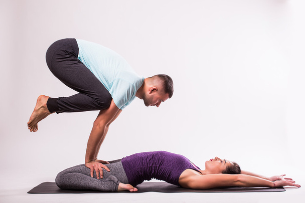Young healthy couple in yoga - Foto, imagen