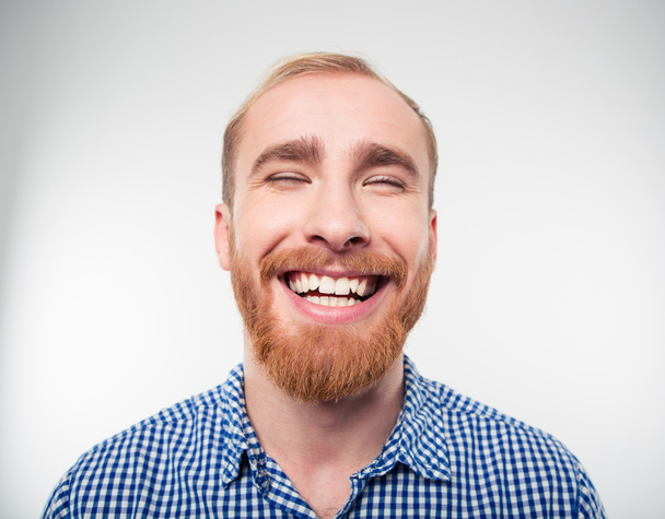 Closeup portrait of a casual man laughing - Photo, image