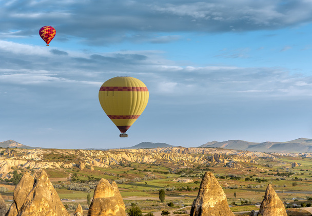 Hot air balloons fly over Cappadocia - Foto, afbeelding