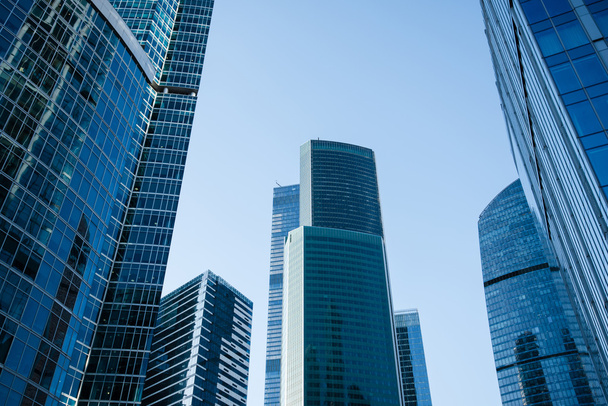 Business skyscrapers against blue sky - Фото, зображення