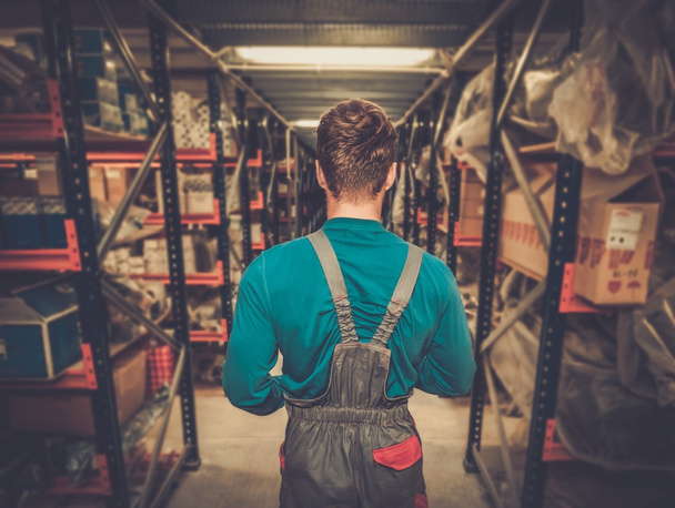 Worker on a automotive spare parts warehouse  - Photo, Image