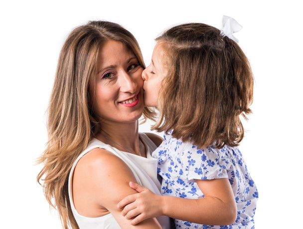 daughter kissing her mother - Fotoğraf, Görsel