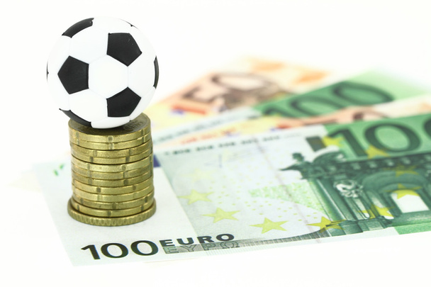Jalkapallo ja rahaa
 - Valokuva, kuva