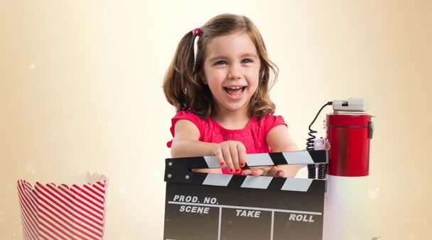 Kid holding a clapperboard - Photo, Image