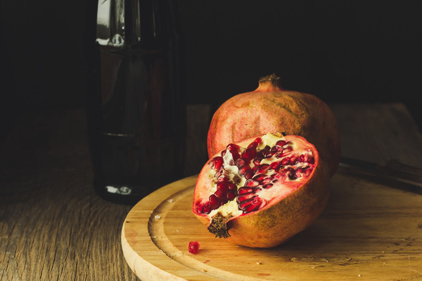 Pomegranates and bottle - Fotografie, Obrázek