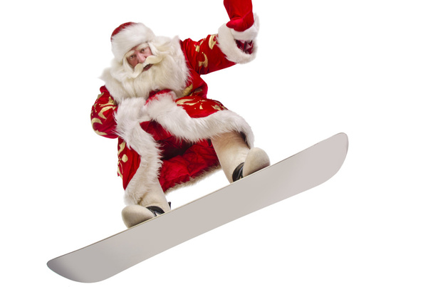 Santa is flying his snowboard - Foto, Imagen