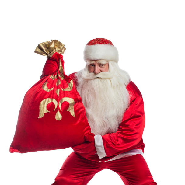 Santa Claus y bolsa de regalos
 - Foto, Imagen