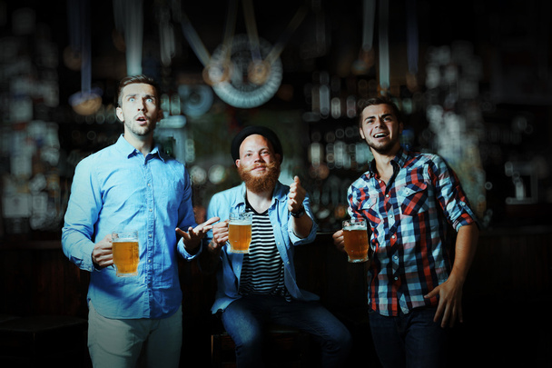 Young men with beer - Фото, зображення