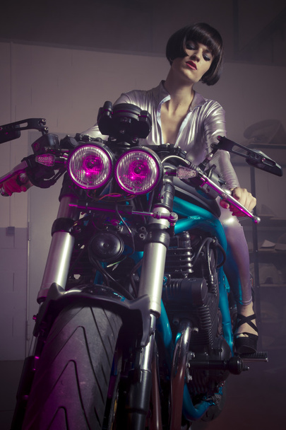 brunette in  latex suit on a bike  - Foto, Imagen