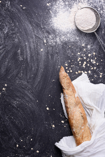 Rural kitchen or bakery background on black chalk board with space for text. Top view, vertical. - Valokuva, kuva
