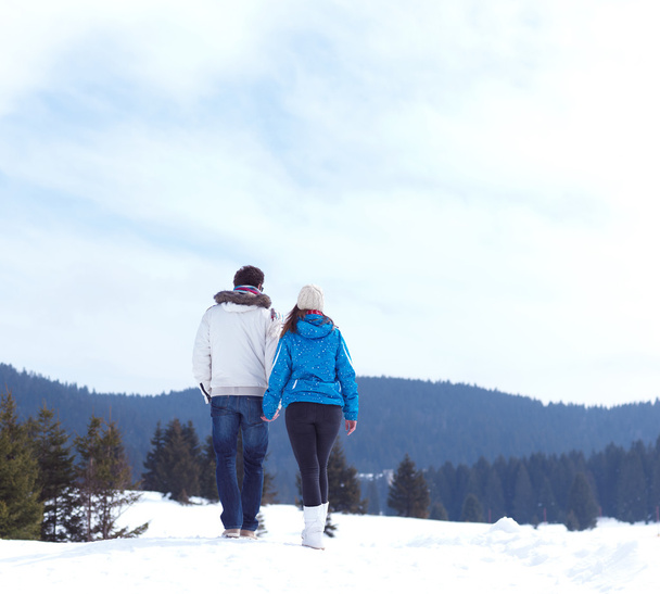 couple having fun on fresh snow on winter vacation - Photo, Image