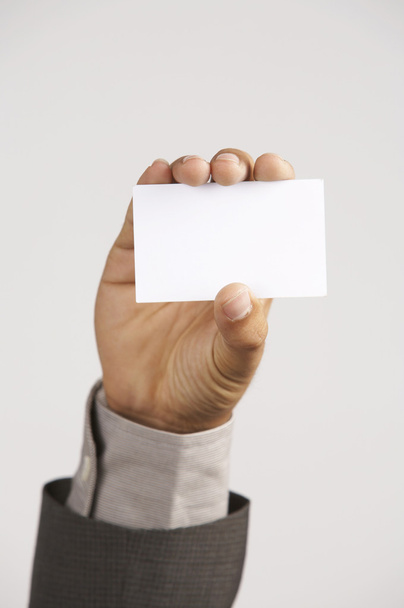Man holding a blank card size signage - Foto, afbeelding