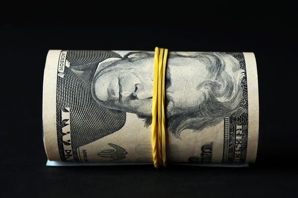 Dollars roll on black background - Zdjęcie, obraz