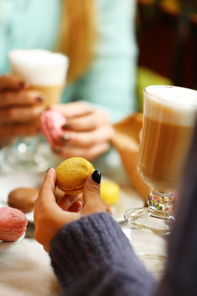 Women meeting in cafe and drinking latte - 写真・画像