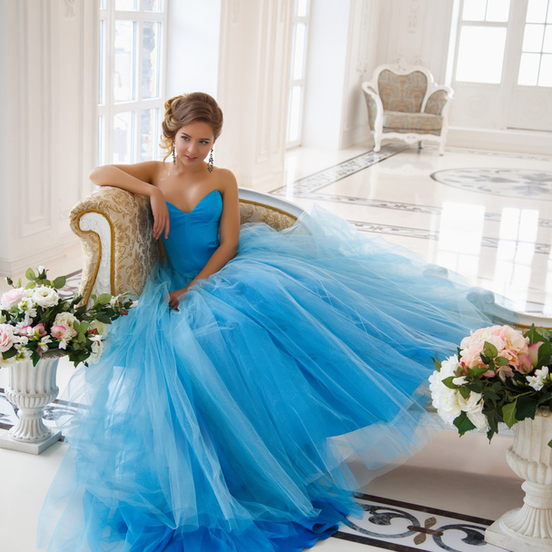 Beautiful bride in gorgeous blue dress Cinderella style in a morning - Foto, Imagen