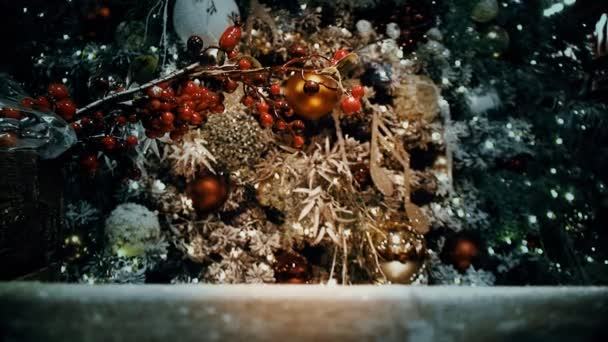 A Fragment of a Christmas tree decorated with toys and garlands - Footage, Video