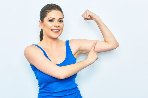 woman shows muscle - Foto, Bild