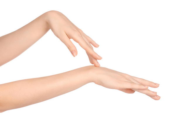 Beauty and Health theme: beautiful elegant female hand isolated on a white background in the studio, using cream advertisement, massage - Φωτογραφία, εικόνα