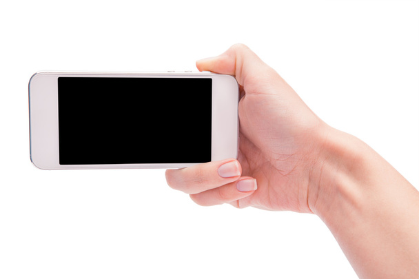 Hand holding White Smartphone with blank screen on white backgro - 写真・画像
