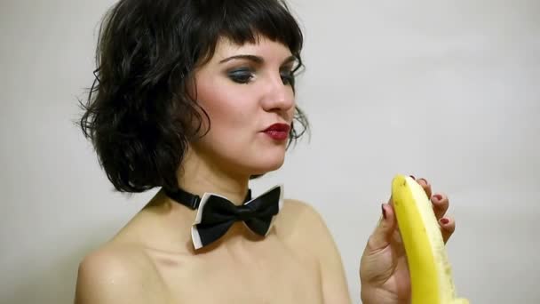 attractive sexy woman eating banana - Кадри, відео