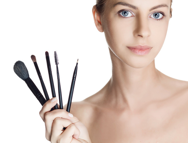 Portrait of beautiful woman with brushes for make-up - Фото, изображение