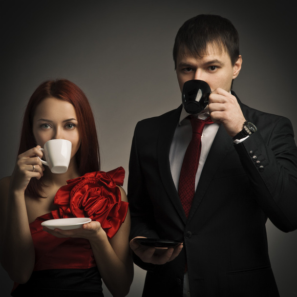 Young elegant couples drinking coffee - Фото, изображение