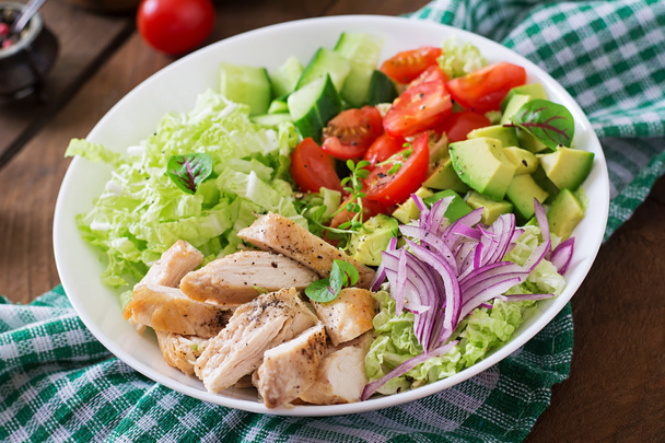 Dietary salad with chicken, avocado, cucumber, tomato and Chinese cabbage. - Фото, изображение