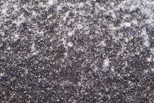 textuur bevroren asfalt van donkere kleur - Foto, afbeelding