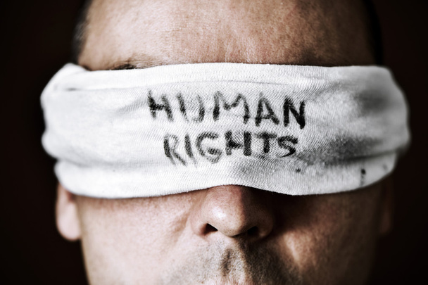 young man with a blindfold with the text human rights - Foto, afbeelding