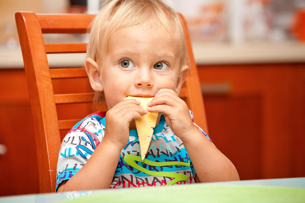 cute baby boy eating - Фото, изображение