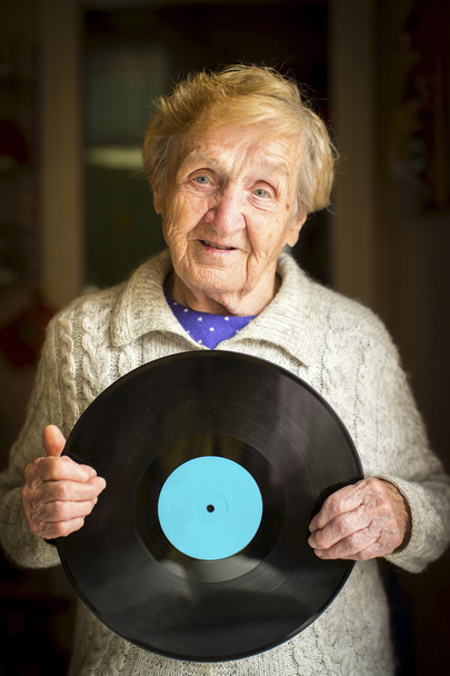 Mujer mayor con vinilo
 - Foto, Imagen