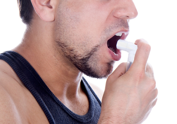 Close up look of a man with pump in his mouth - Fotoğraf, Görsel