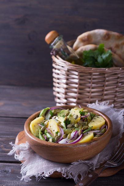 Potato salad with pickles, avocado and red onion - Photo, image