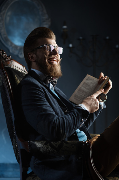 A nice man in glasses with a book - Foto, Imagen