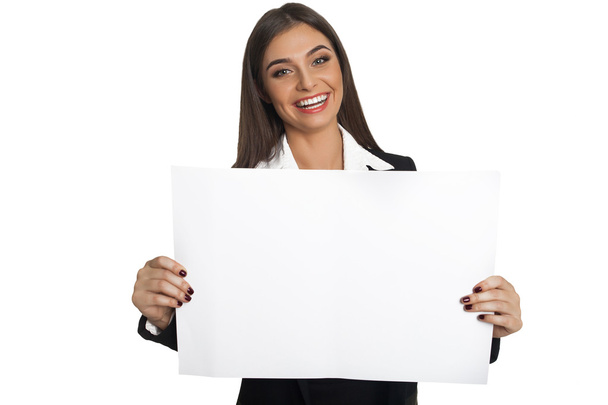 Woman holding sheet of paper - Foto, Imagen