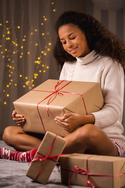 Happy woman with christmas gifts - Фото, зображення