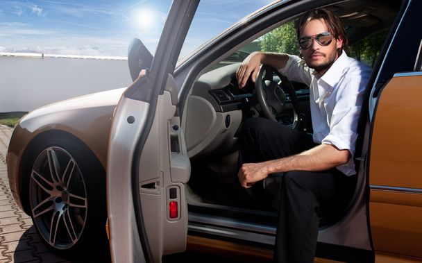 Portrait of business man inside the car - Photo, Image