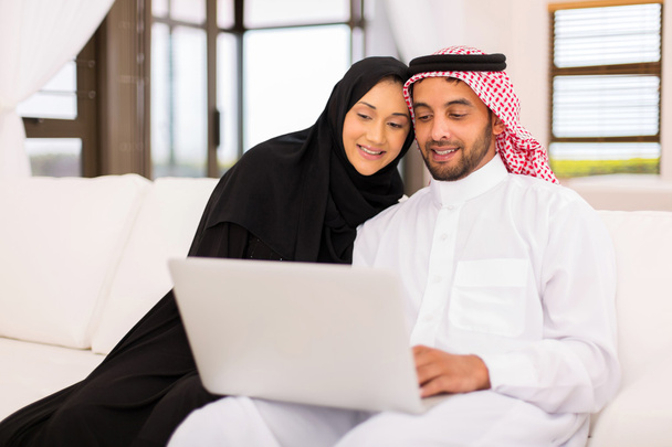 muslim couple using laptop computer - Фото, изображение